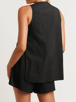 Black linen co-ord set with cut-out back detail and buttoned shorts.
