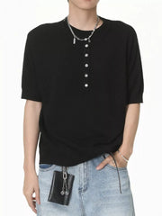 Black short sleeve henley t-shirt with button placket and crew neck.