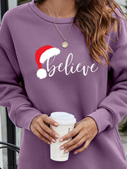 Dusty Purple Christmas graphic tunic sweatshirt with "believe" text and Santa hat graphic.