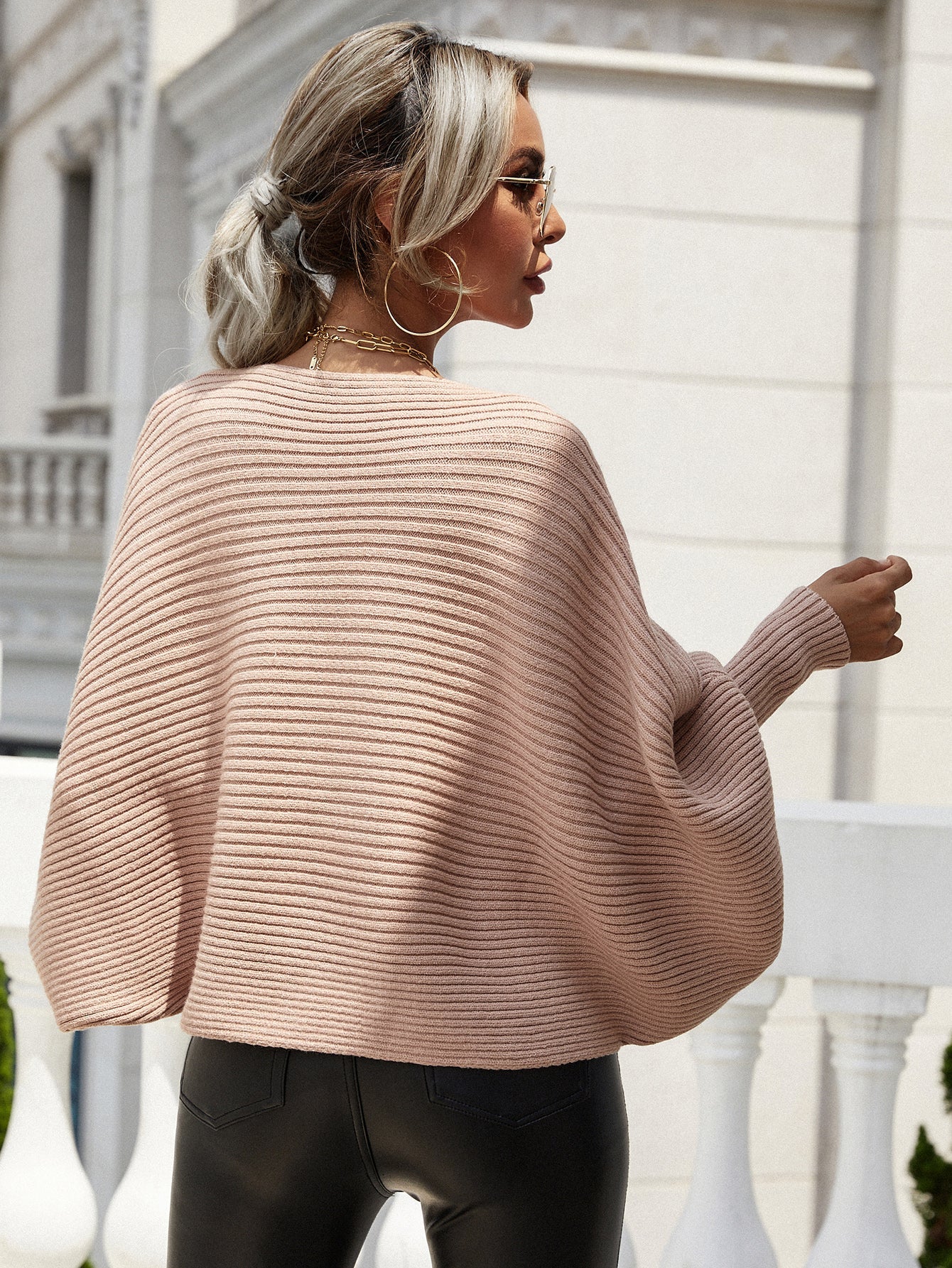 Rose boat neck ribbed dolman knit sweater with wide sleeves.