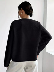 Black textured button-up fleece outerwear with long sleeves and a crew neckline.