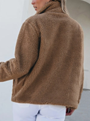 Brown sherpa zip-up jacket with fuzzy texture and collar.
