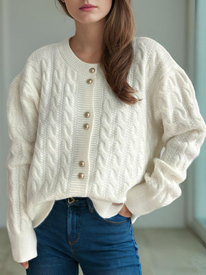 White cable knit cardigan with puff sleeves and gold buttons