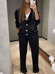 Black button-front lounge set with drawstring pants and white tank top.