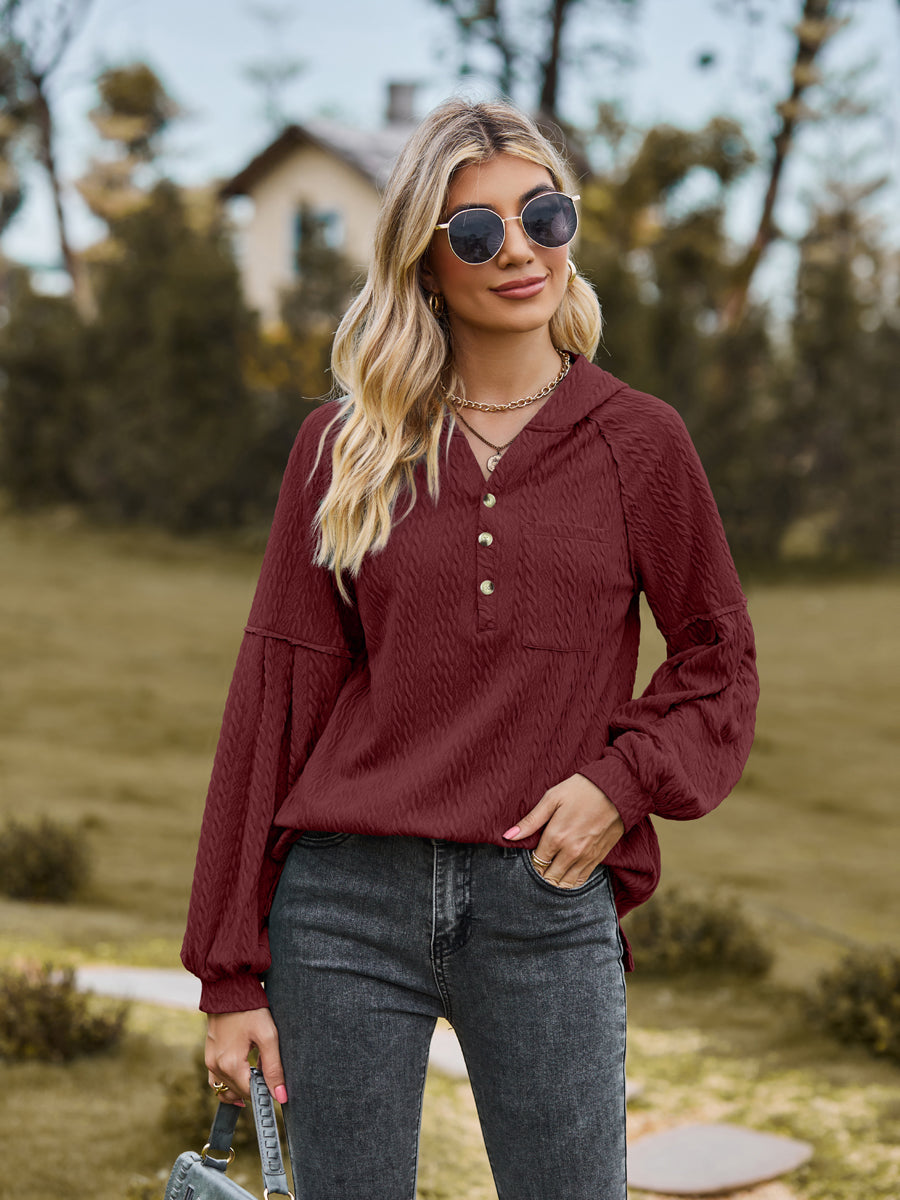 Textured knit henley in wine with balloon sleeves and button detail