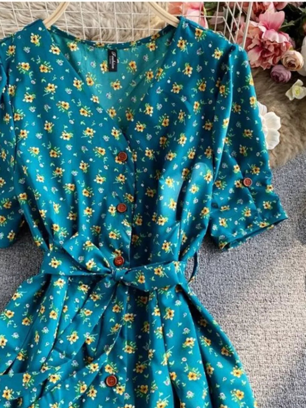 Turquoise floral v-neck midi dress with button front and belted waist