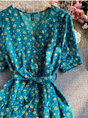 Turquoise floral v-neck midi dress with button front and belted waist