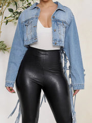 Cropped denim trucker jacket in medium wash with macramé back detail and tie accents.