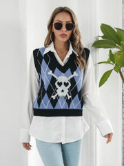 Argyle knit vest in black with a skull and crossbones intarsia pattern and V-neck.