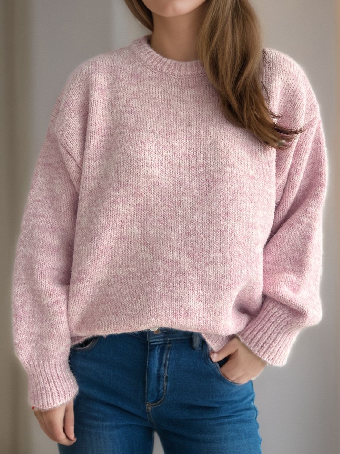 Oversized crewneck sweater in dusty pink textured knit with ribbed cuffs and hem.