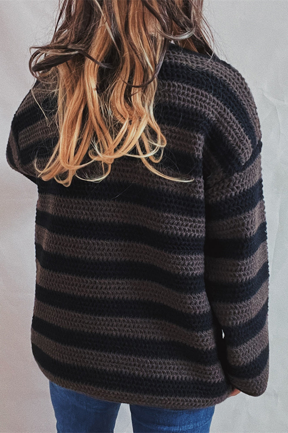 Chunky knit sweater with black and brown stripes, boat neck, long sleeves.