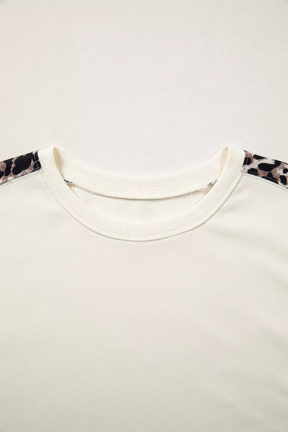 Leopard Patchwork Uneven Hem Short Sleeve Top, model styling view
