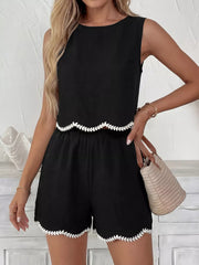 Black tank top and shorts set with white scalloped trim detail.
