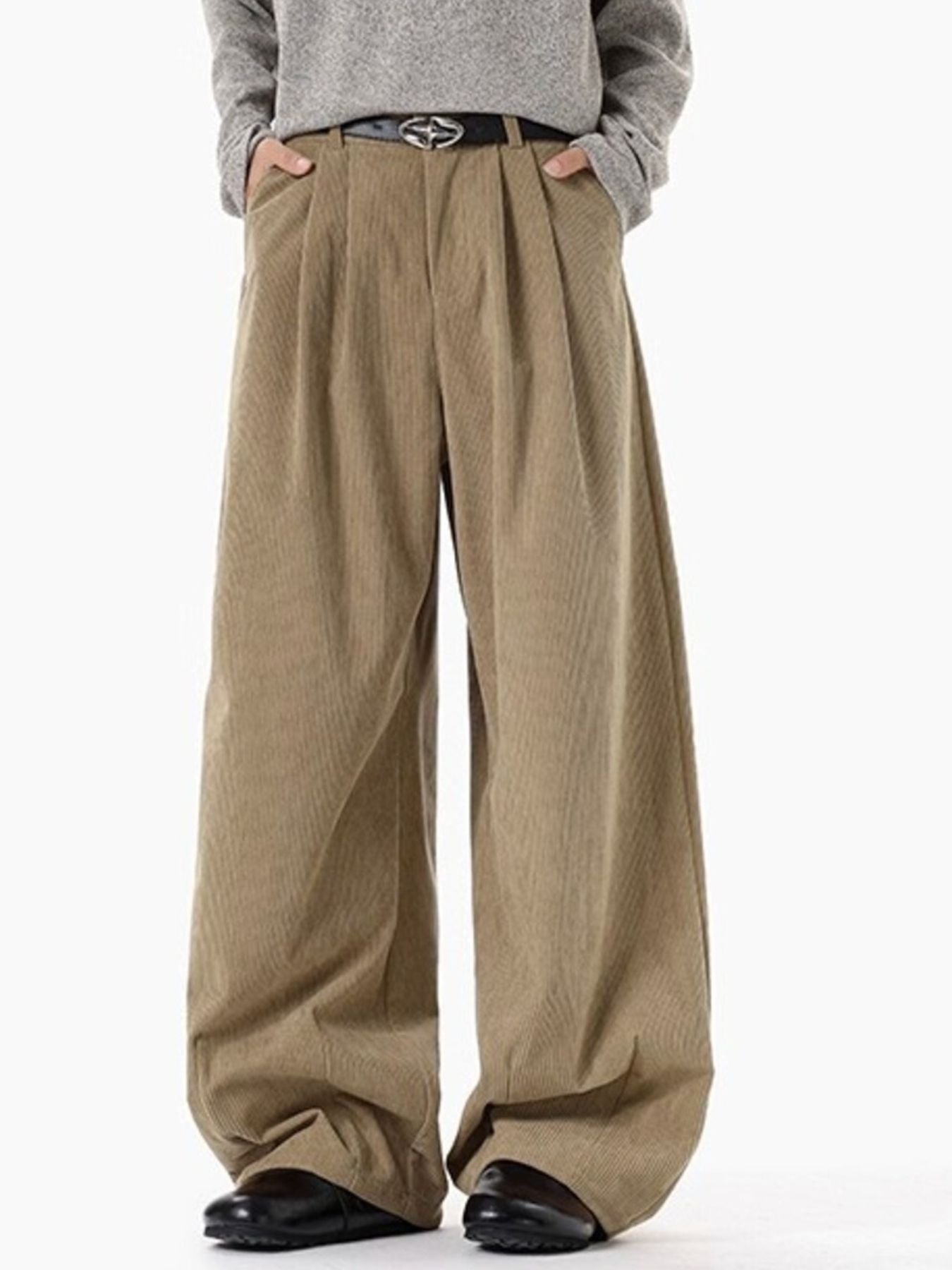 Men's khaki pleated wide leg corduroy trousers with a relaxed fit.
