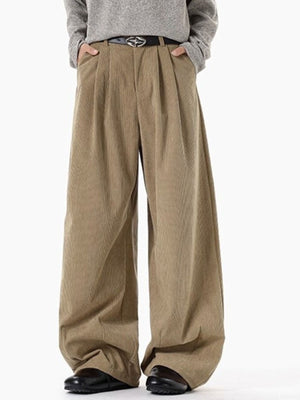 Men's khaki pleated wide leg corduroy trousers with a relaxed fit.