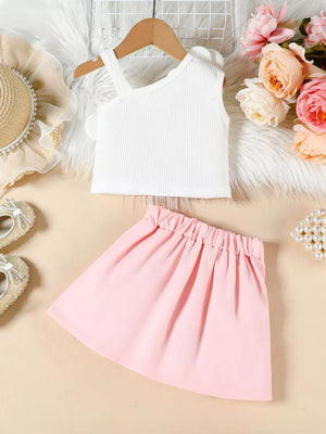 Baby girls' pink pleated skirt and white ribbed tank top with floral applique.