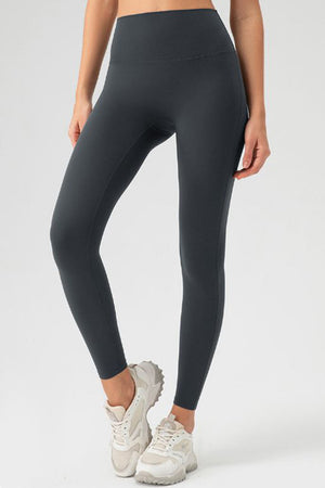 Dark Gray high-waist performance leggings with sculpting seams.