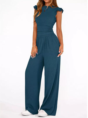 Blue maternity two-piece ensemble with ruffled cap sleeves, crew neck, and wide-leg pants.