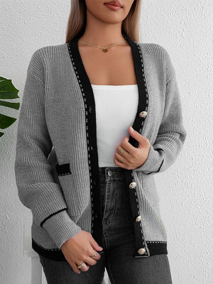Gray knit cardigan with black contrast trim and gold buttons