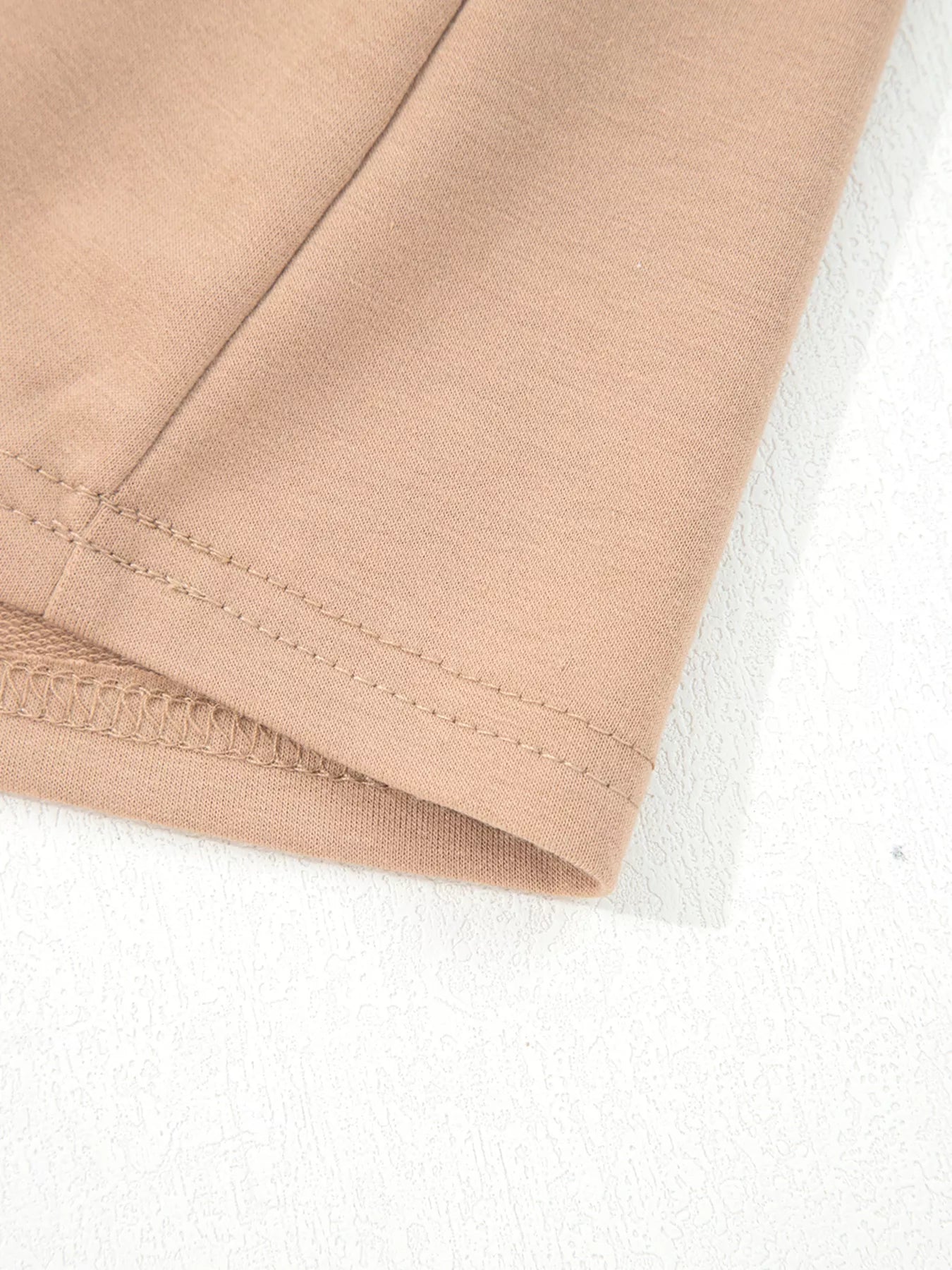Braided puff sleeve dress in khaki with visible stitching detail