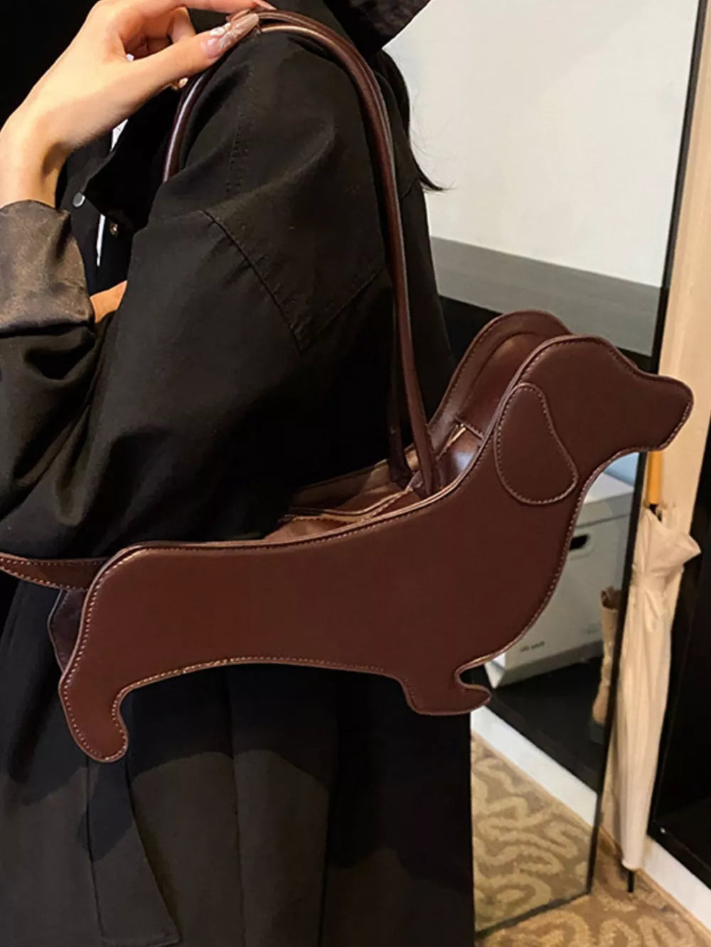 Charming dachshund shoulder bag in coffee pu leather with unique dog shape.