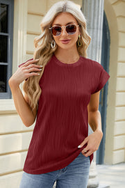 Burgundy textured cap sleeve top with a crew neck and vertical ribbing detail.