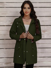 Military green drawstring trench coat with snap-down front and plaid lining detail.