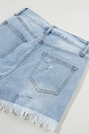 Light blue distressed denim cutoff shorts with frayed hem and ripped details.