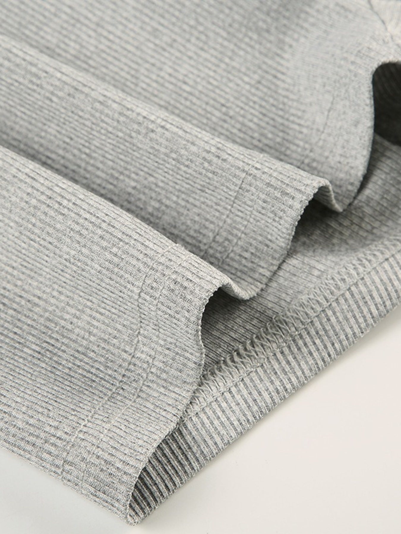 Gray ribbed long sleeve buttoned romper detail