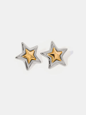 Sculpted starburst stud earrings in silver and gold with a celestial design.