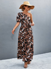 Tropical print one-shoulder maxi dress with balloon sleeves and tie waist.