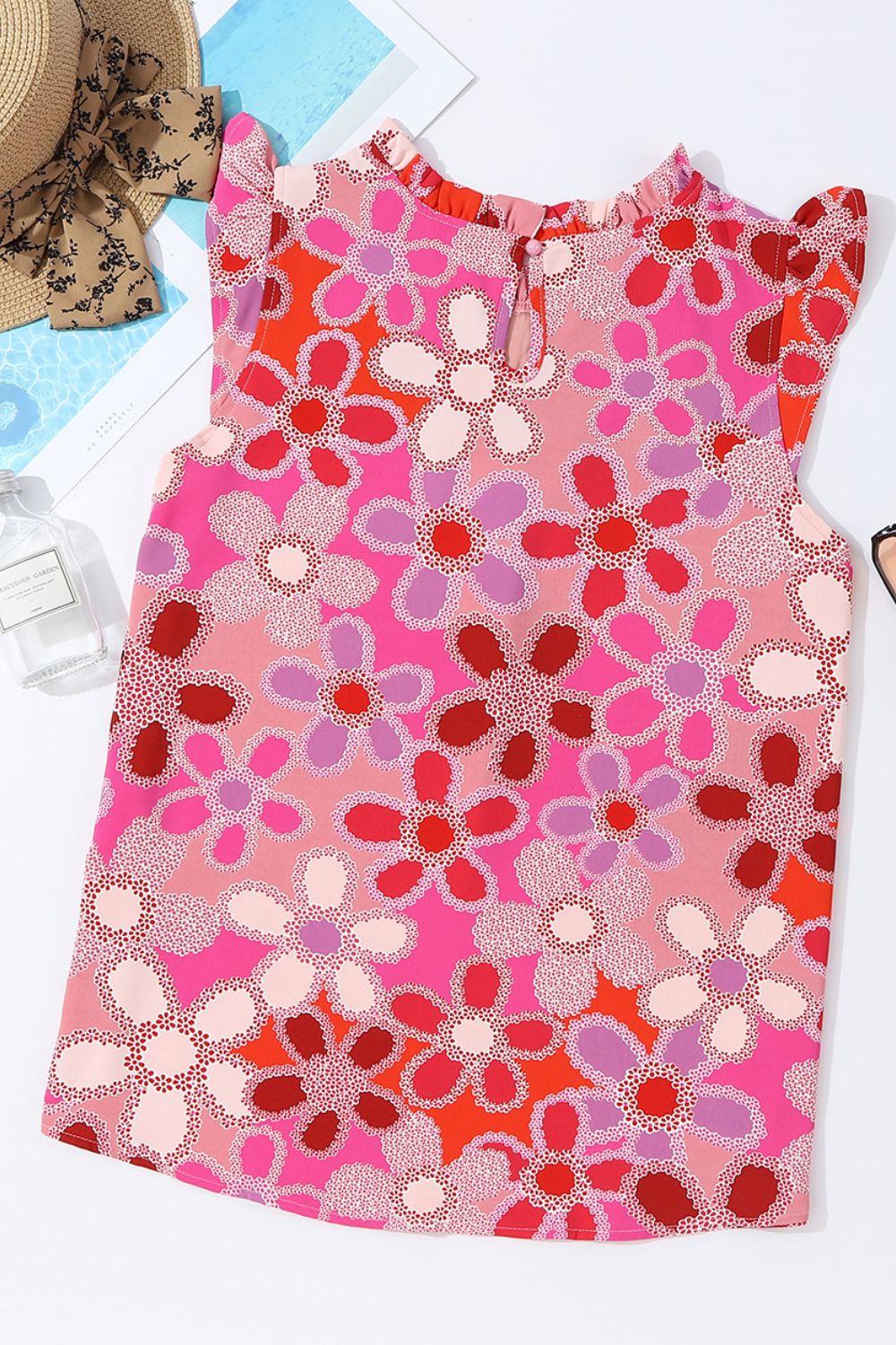 Floral embroidered yoke ruffle sleeve top in strawberry pink with a bold floral print.