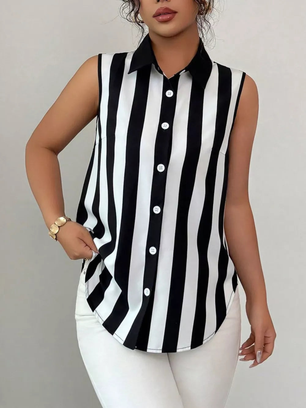 Sleeveless collared shirt in black and white stripes with button front.