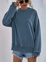 Dusty Blue sweatshirt with V-neck detail and ribbed cuffs and hem.