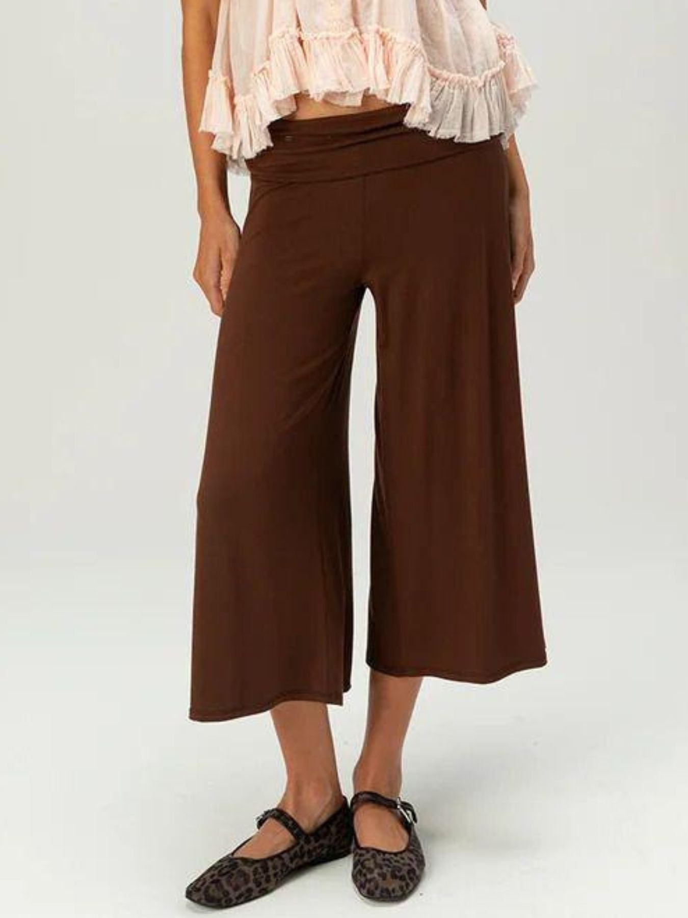 Brown relaxed wide leg capris with a comfortable fit and a cinched waist.