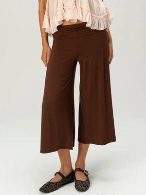 Brown relaxed wide leg capris with a comfortable fit and a cinched waist.