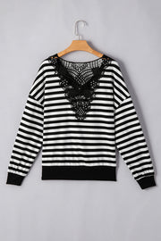 Black and white striped blouse with black lace detail on the back.