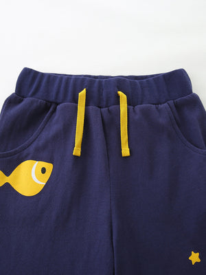 Navy cotton baby pants with yellow fish graphic and drawstring waist.
