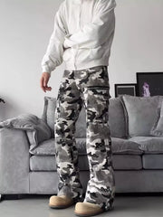 Camouflage utility wide-leg sweatpants with cargo pockets and zipper details.