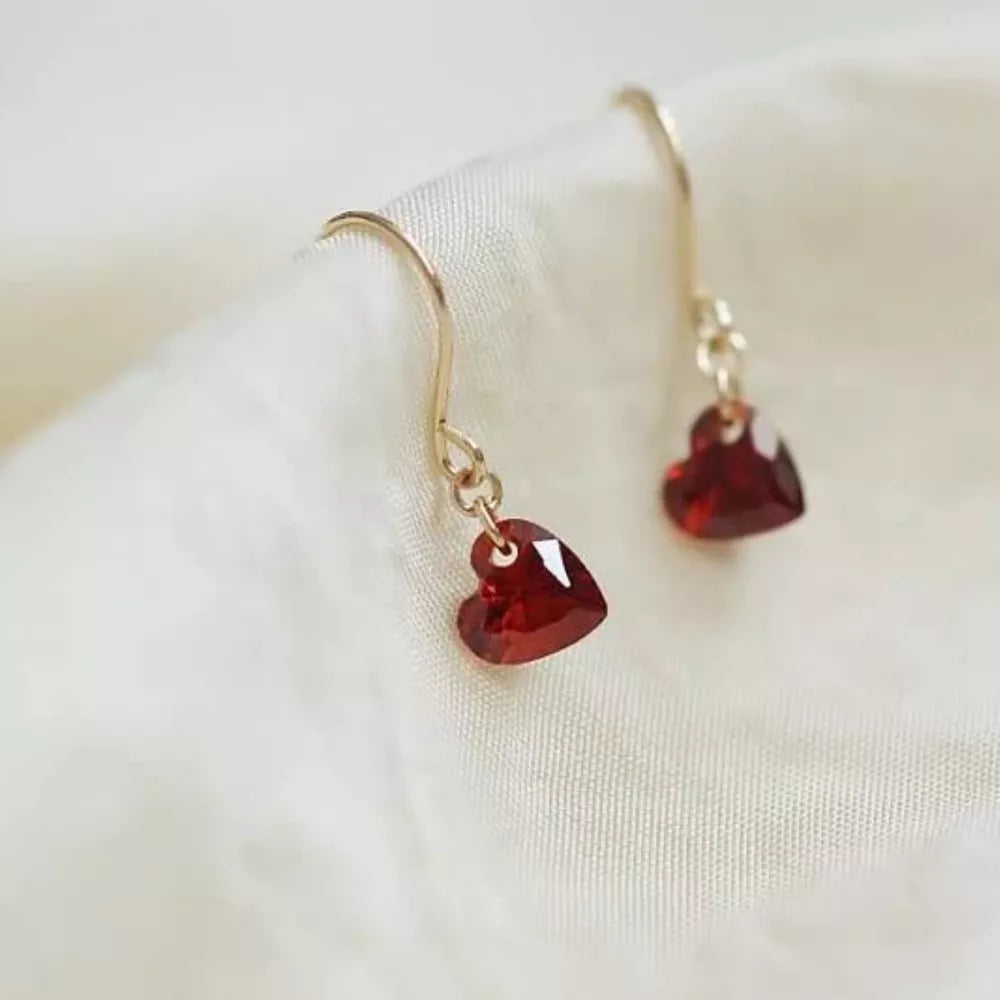 Elegant red heart-shaped zircon drop earrings with gold hooks.