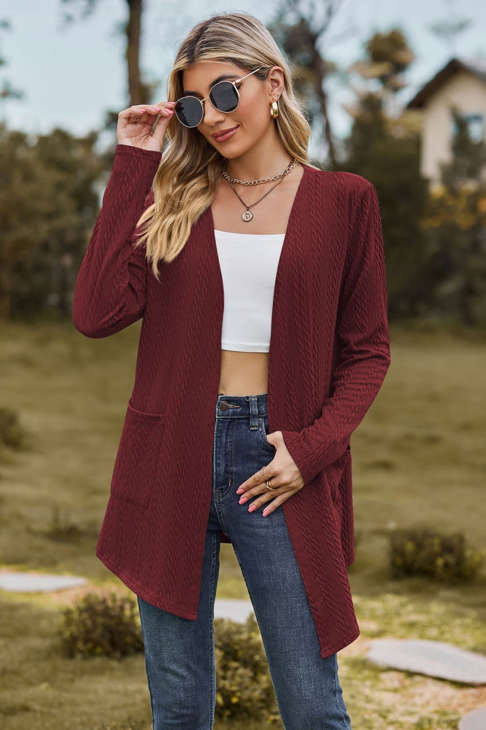 Burgundy textured open-front cardigan with pockets and long sleeves.
