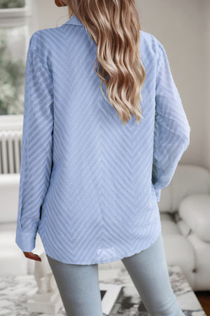 Light blue textured chevron button-down blouse with long sleeves