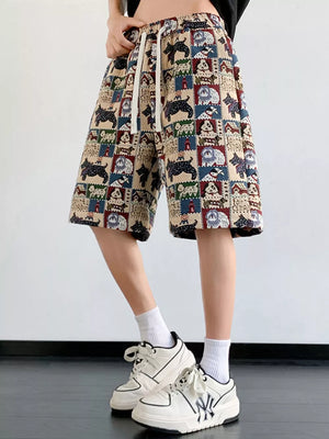 Lightweight drawstring shorts in tan with a playful panda and dog print.