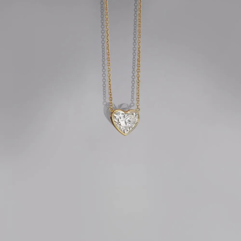 Bezel-set heart diamond solitaire necklace on 18K gold-plated chain
