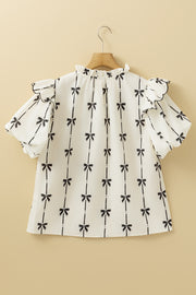Ivory blouse with black bow print, ruffled neckline and short sleeves.