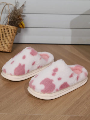 Blush pink cow print faux fur house slides with soft lining and platform sole.