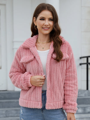 Textured teddy bear jacket in light mauve with button front and chest pockets.