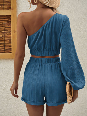 Textured one-shoulder crop top and cuffed shorts set in Royal Blue.