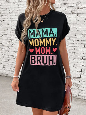 Black graphic tee dress with Mama Mommy Mom Bruh text, short sleeves, and crew neck.