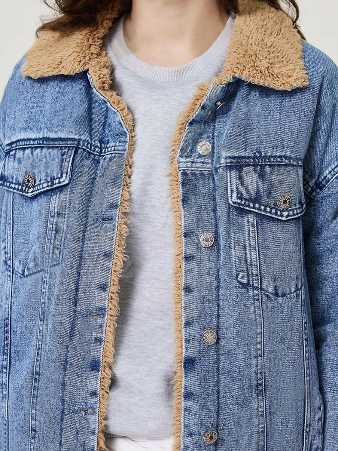 Light acid wash denim trucker jacket with sherpa collar and lining.